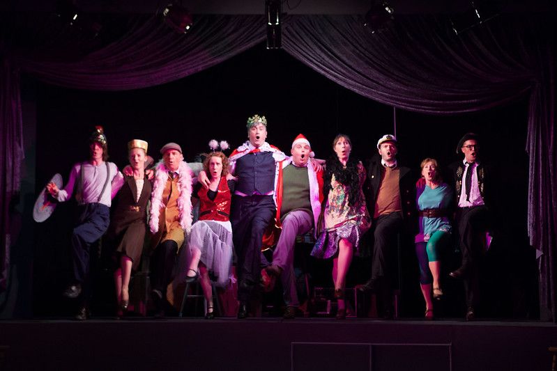 Paul Cozens (with crown) leads the kick line in A Man of No Importance